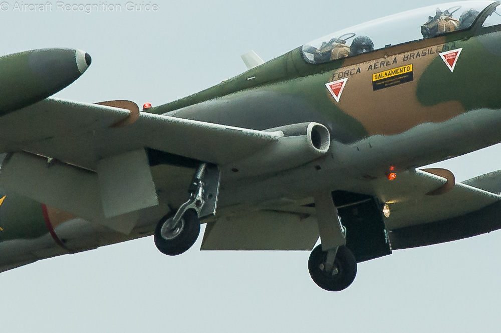 This photo shows the outward retracting main gear of the MB326, as well as the wing fence in the leading edge. Image