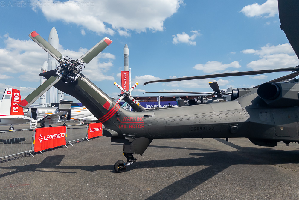 The tail boom of the AW249 has flat sides with a distinct body line. The A129's type tail gear remains, but the AW249 has a four blade tail rotor on the right, that is slightly tilted to the left. Image