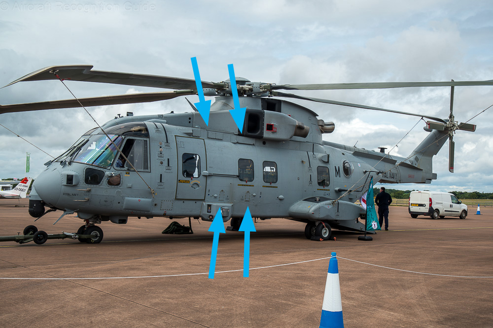 On the left side the Merlin HC4 is recognised best by the access panels marked by the two top arrows. The bottom arrows point at the covered refuelling points, the main difference compared to the Merlin HC4A. Image