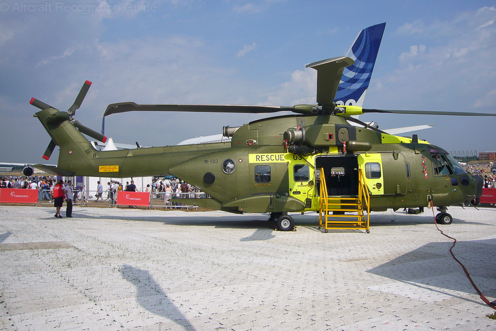 With the sliding doors open it is difficult to see that the EH101 Mk512 has two pairs of large cabin windows on the right. The single one and the bubble window are visible though. Image