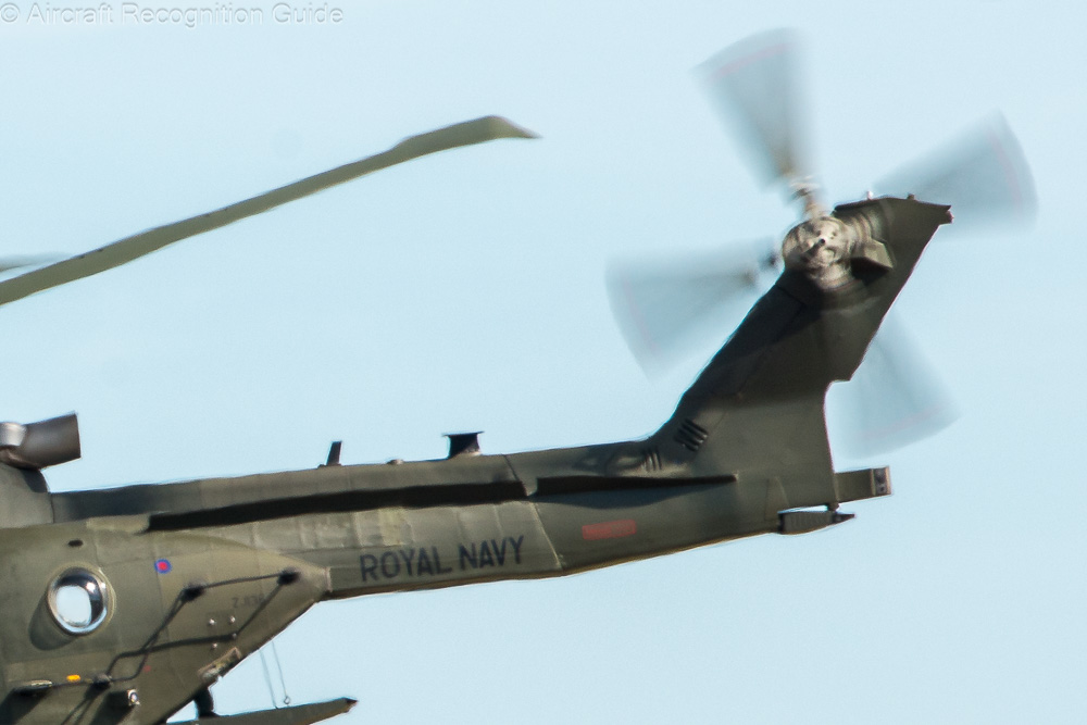 Here you can clearly see the strake along the majority of the tail boom, cut in two where the tail boom can be folded. Image