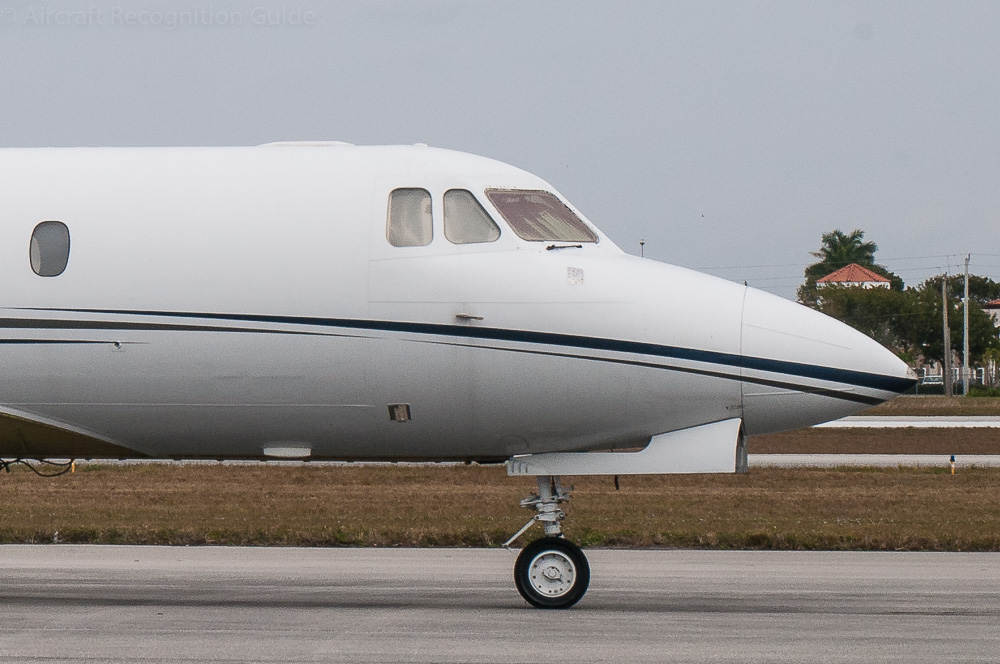 The nose of the Series 600 and 700 with a cockpit roof flush with the fuselage, but still flat cockpit windows. Image