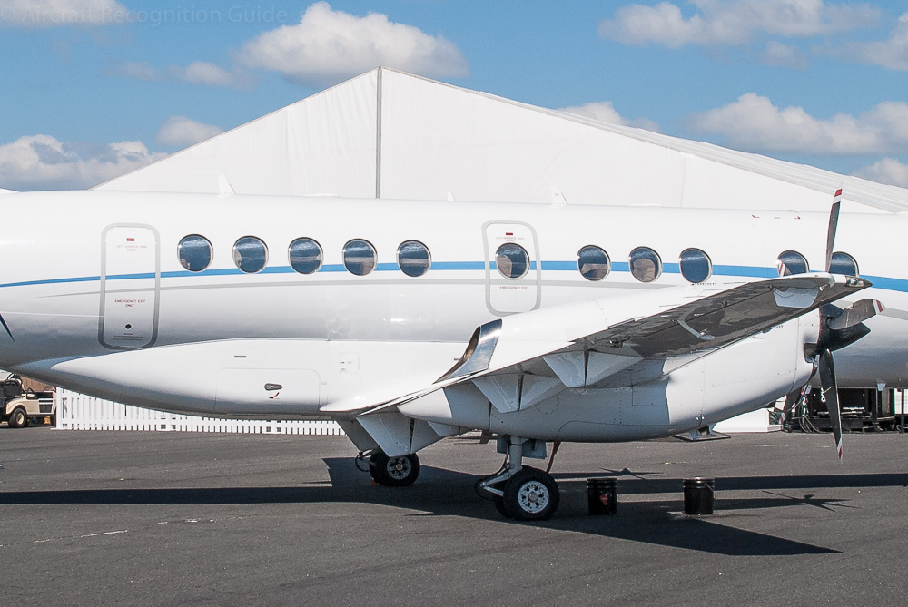 As the wings of the Jetstream 41 go underneath the fuselage, a big streamline fairing it put around the attachement points. Image