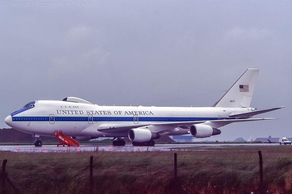 The Boeing E-4B has a big radome op top of the fuselage, behind the upper deck. Also note the CF6 type nacelles. Image