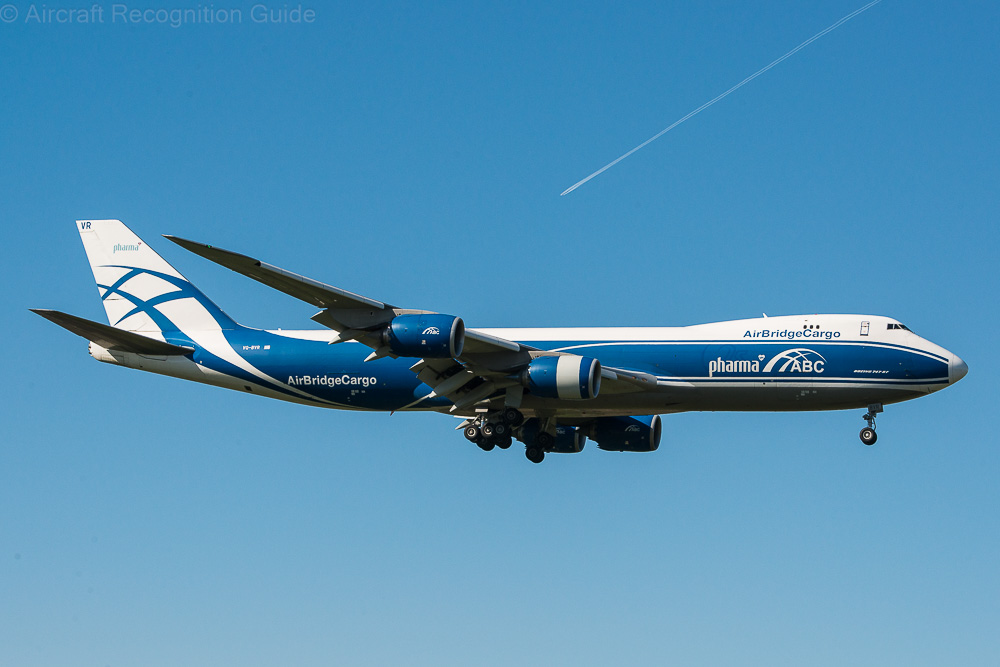 The Boeing 747-8F is longer than the 747-400F, and has the other features of the 747-8, like the nacelles and wingtips. Image