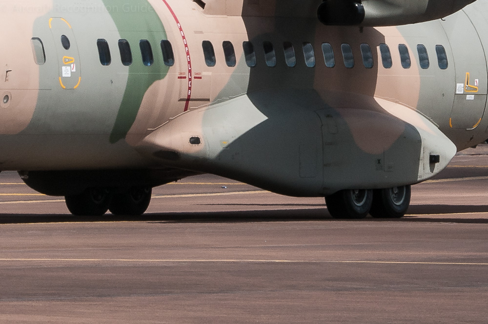 The tandem wheel main gear is similar to that of the Lockheed Hercules, and retracts in streamlined bodies. Image