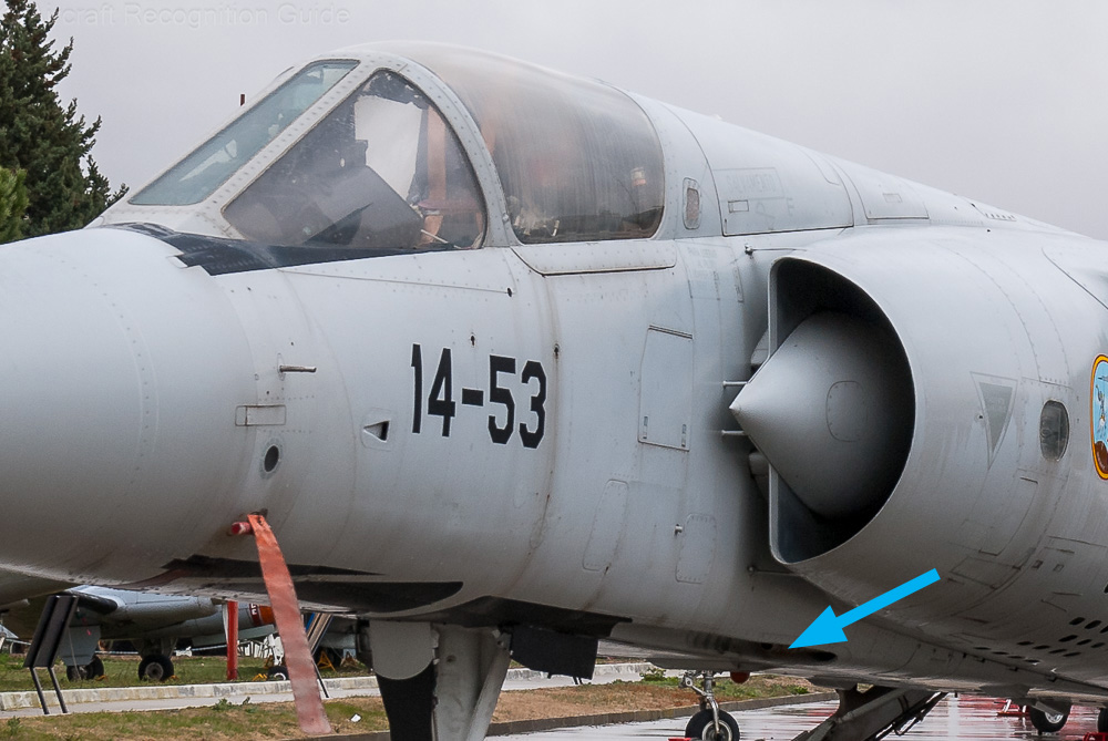 The canopy and the semi-circular air intakes with centre cones are the main feature of the Mirage F1. The arrow points at the location of the cannon. Image