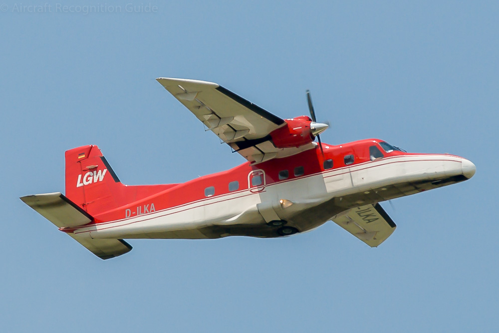 When viewed from the right you can see the single emergency exit below the wing, typical for the Do228-100 and -101. Image