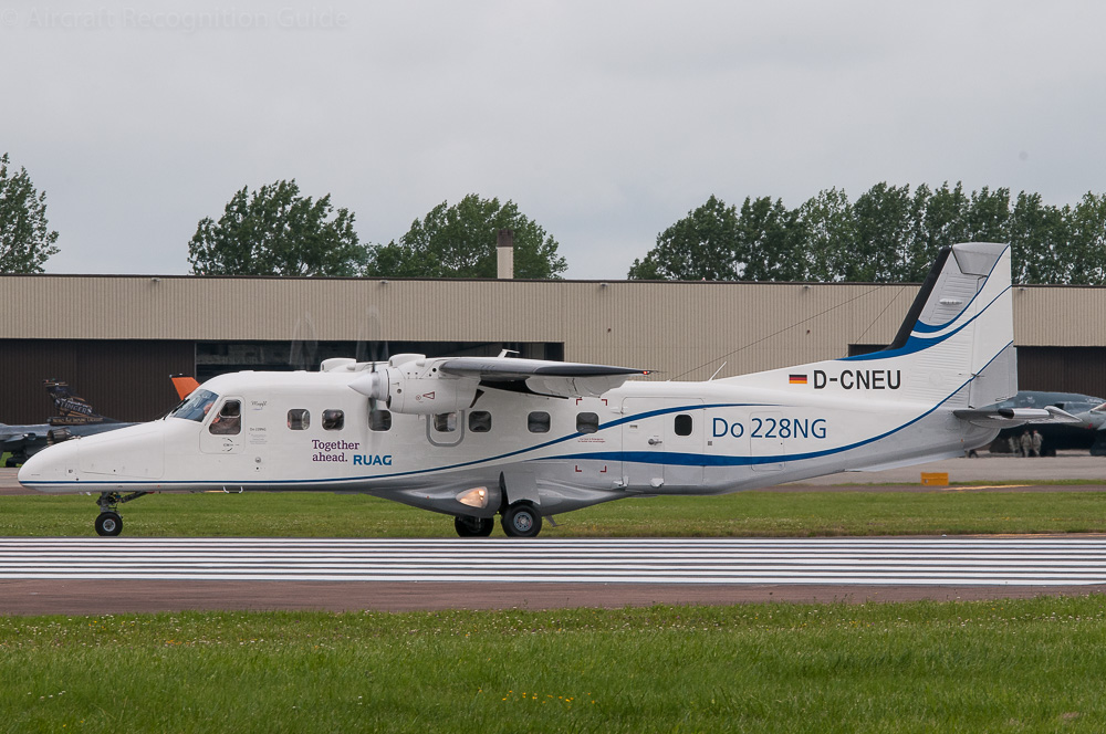 On the outside the only clear visible feature of the Do228NG is the five blade props, but titles also help. Image