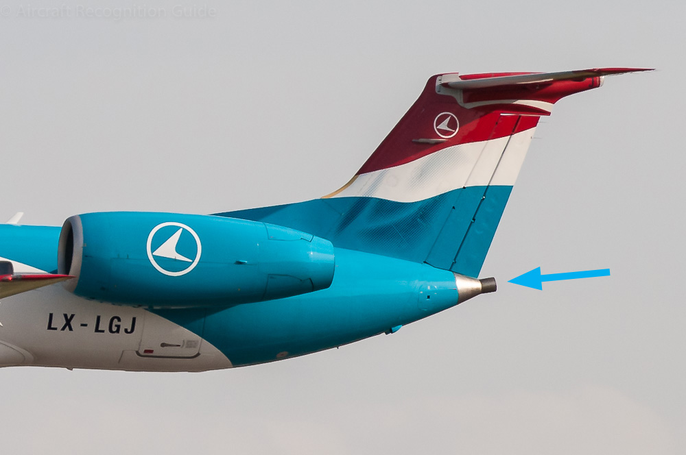 The exhaust pipe of the APU is quite typical for the EMB135/EMB145. Also note the single exhaust engine nacelles and EMB120-like tail. Image