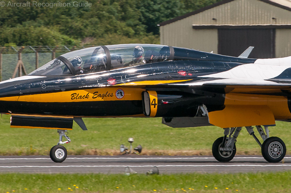 This close-up shows you the rounded rectangular air intake and F-16-like landing gear of the KAI T-50. Image