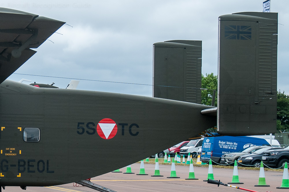 The rear fuselage of the Short Skyvan slopes up quickly and has a flat door opening up and inward. At the end is an H-tail. Image